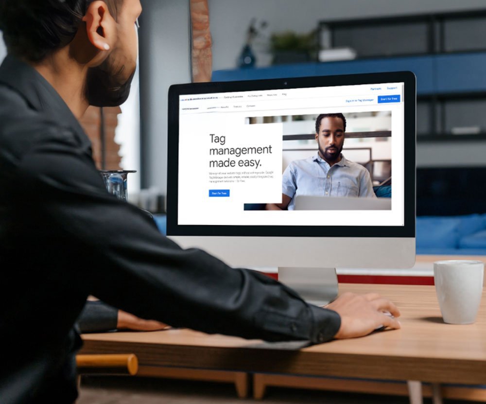 Man viewing a tag management tutorial on his computer.