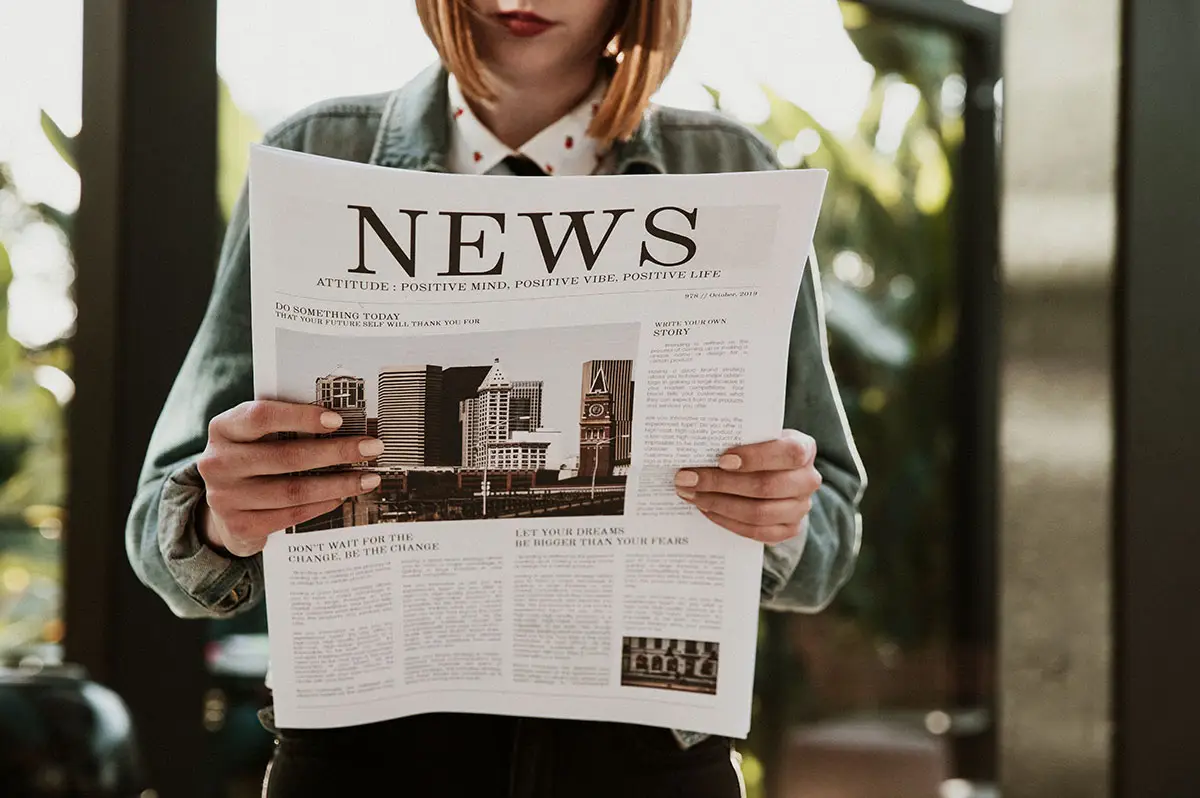 Woman reading paper news