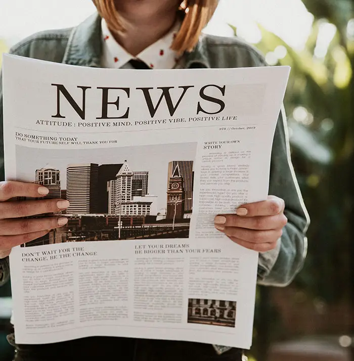 Woman reading paper news